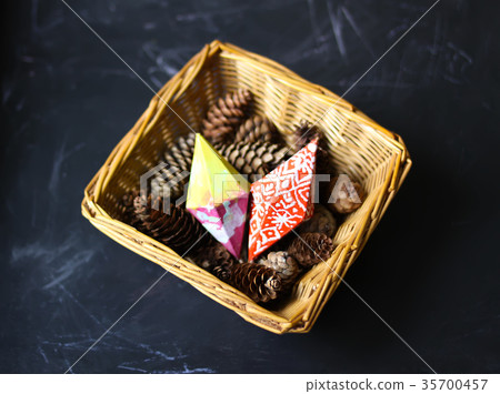 Christmas card with decorations in a small basket. Christmas card with decorations in a small basket. 35700457