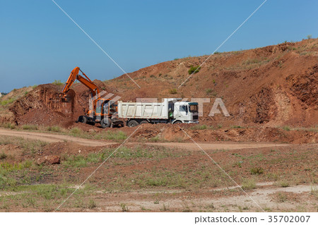 excavator loads a truck excavator loads a truck 35702007
