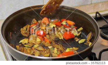 Preparing hot breakfast Preparing hot breakfast 35702113