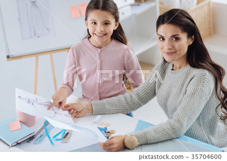 Nice positive mother and daughter looking at you 35704600