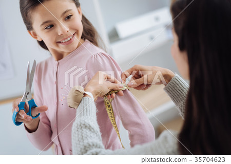 Pleasant nice girl holding scissors 35704623