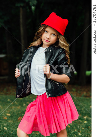 Outdoor lifestyle portrait of stylish little girl 35704761