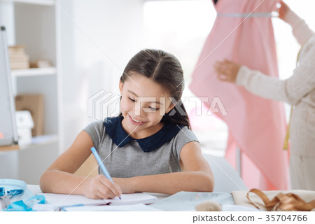 Smart creative girl noting down her ideas 35704766