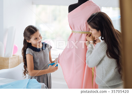 Cute smart girl holding scissors 35705420