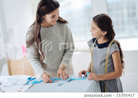 Nice positive woman teaching her daughter to make 35705457