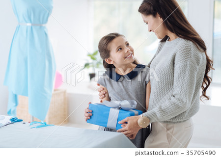 Cute nice girl receiving a present 35705490