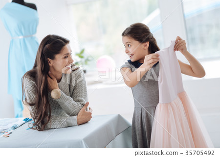 Happy excited girl taking a dress 35705492