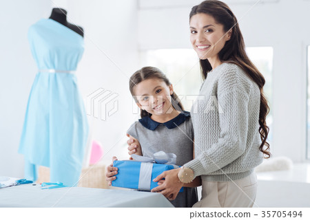 Happy attractive woman hugging her daughter 35705494