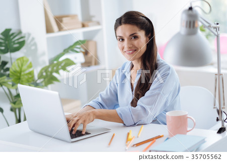 Delighted attractive woman looking at you 35705562
