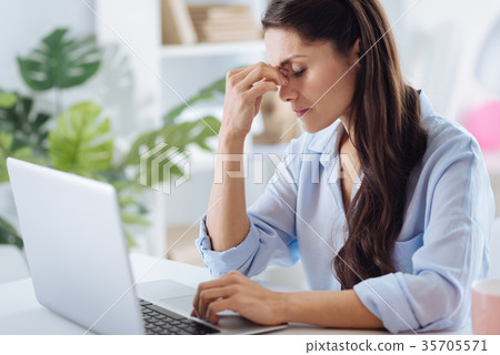 Nice tired woman holding her bridge of nose 35705571