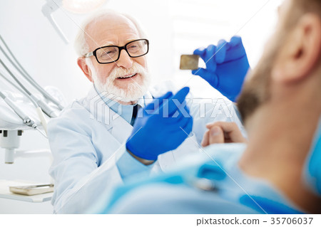 Close up of professional dentist with Xray image Close up of professional dentist with Xray image 35706037