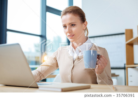 Busy manager preparing significant report Busy manager preparing significant report 35706391