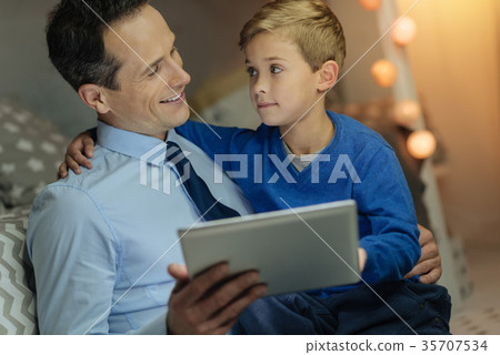 Attentive man child listening to his daddy Attentive man child listening to his daddy 35707534