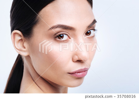 Close up of charming brunette with an intent stare 35708016