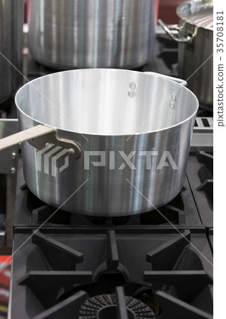Metal stainless steel pan on a kitchen stove  35708181