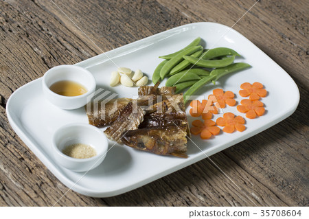 Smoked fish Mackerel or Scomber on a white plate 35708604