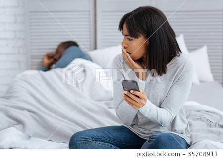 Young emotional woman discovering a secret of her 35708911