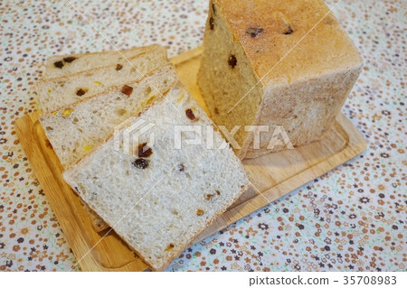 Cross section of bread with dried fruits Cross section of bread with dried fruits 35708983