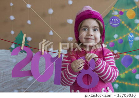 New Year 2018 concept. Beautiful small girl New Year 2018 concept. Beautiful small girl 35709030