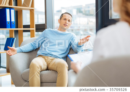 Nice handsome man talking to his doctor 35709326
