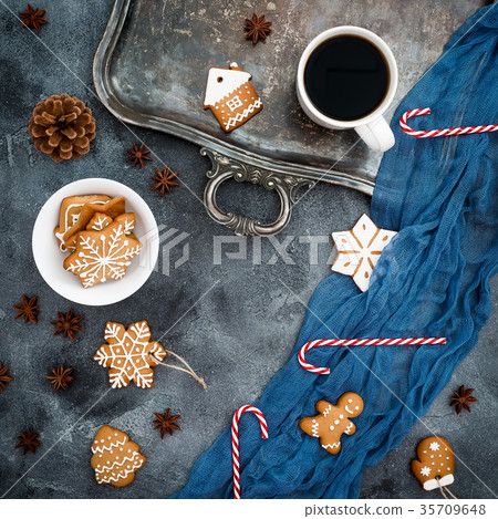 Gingerbread, candy cane and coffee cup on dark 35709648