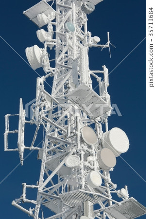 Transmitter tower frozen in winter frost 35711684