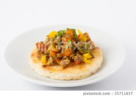 Colombian arepa topped with ground beef 35711837