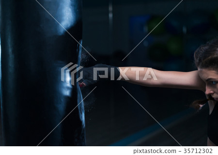 fighter boxer fit girl wearing hand bandage in fighter boxer fit girl wearing hand bandage in 35712302