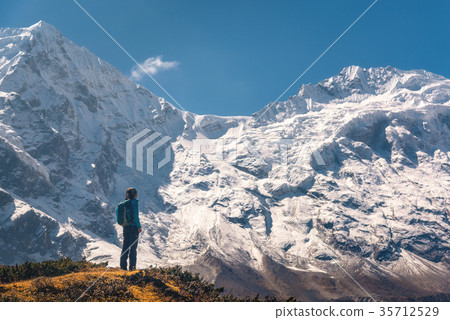 Standing young woman on the hill  35712529