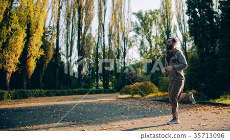 Active healthy runner jogging in the morning. 35713096