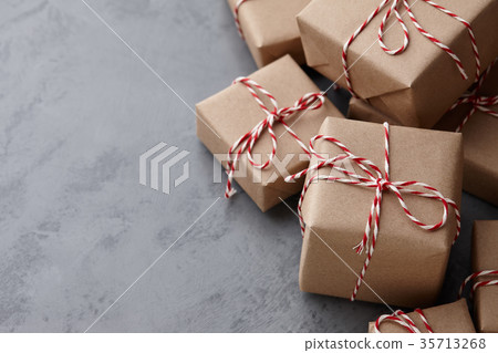 Christmas gift or present boxes wrapped in kraft paper Christmas gift or present boxes wrapped in kraft paper 35713268