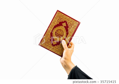 Koran in hand ,Quran in hand - holy book of Muslim Koran in hand ,Quran in hand - holy book of Muslim 35715415
