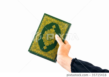Koran in hand ,Quran in hand - holy book of Muslim Koran in hand ,Quran in hand - holy book of Muslim 35715418
