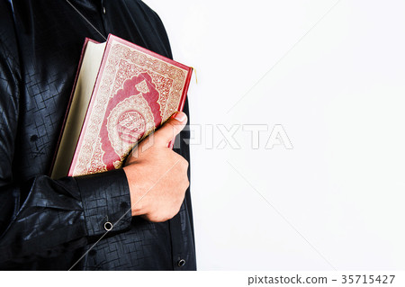 Koran in hand ,Quran in hand - holy book of Muslim 35715427
