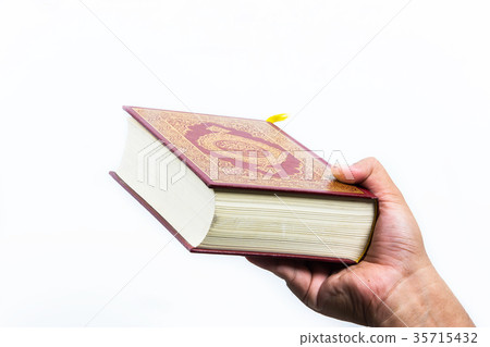 Koran in hand ,Quran in hand - holy book of Muslim Koran in hand ,Quran in hand - holy book of Muslim 35715432