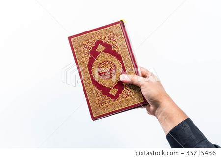 Koran in hand ,Quran in hand - holy book of Muslim Koran in hand ,Quran in hand - holy book of Muslim 35715436