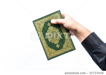 Koran in hand ,Quran in hand - holy book of Muslim Koran in hand ,Quran in hand - holy book of Muslim 35715438