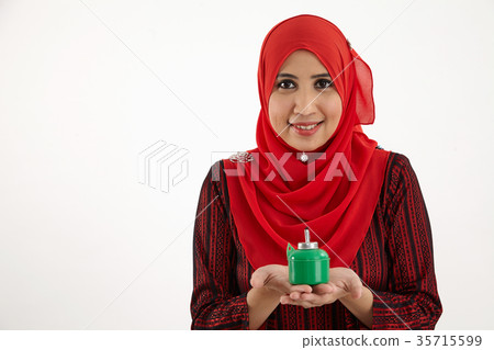 woman holding pelita woman holding pelita 35715599
