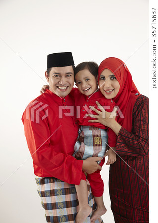 family in red baju raya 35715632