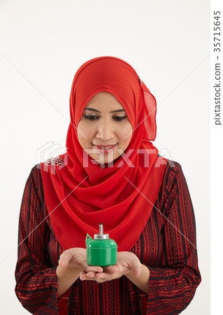 woman holding pelita woman holding pelita 35715645