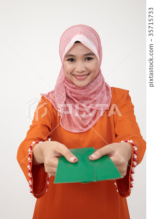 malay girl with tudung with green envelope 35715733