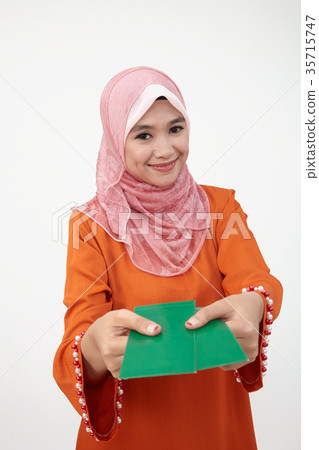 malay girl with tudung with green envelope 35715747