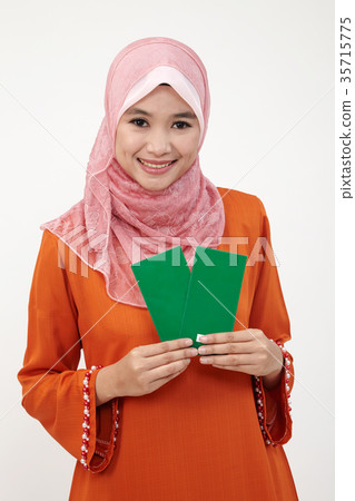 malay girl with tudung with green envelope 35715775