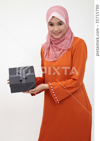 malay girl with tudung holding gift box 35715780