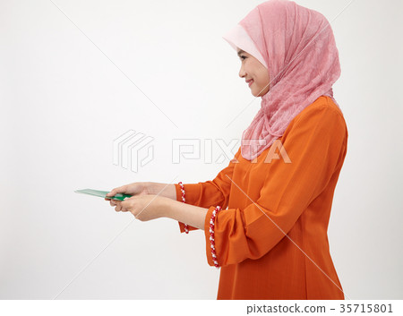 malay girl with tudung with green envelope 35715801