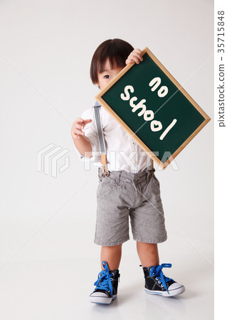 boy holding black board 35715848