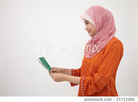 malay girl with tudung with green envelope 35715900