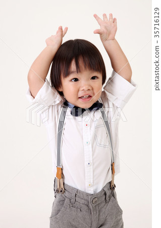 boy raising his arm boy raising his arm 35716129