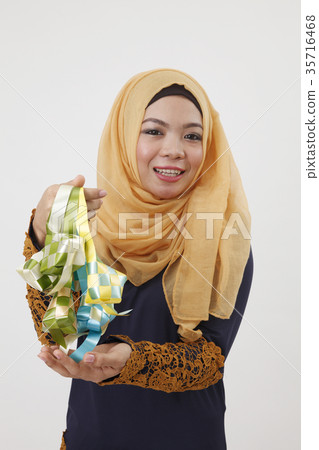 malay woman showing ketupat 35716468