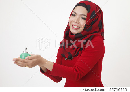 woman holding pelita woman holding pelita 35716523
